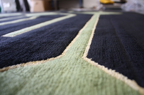 Custom green geometric wool design rug