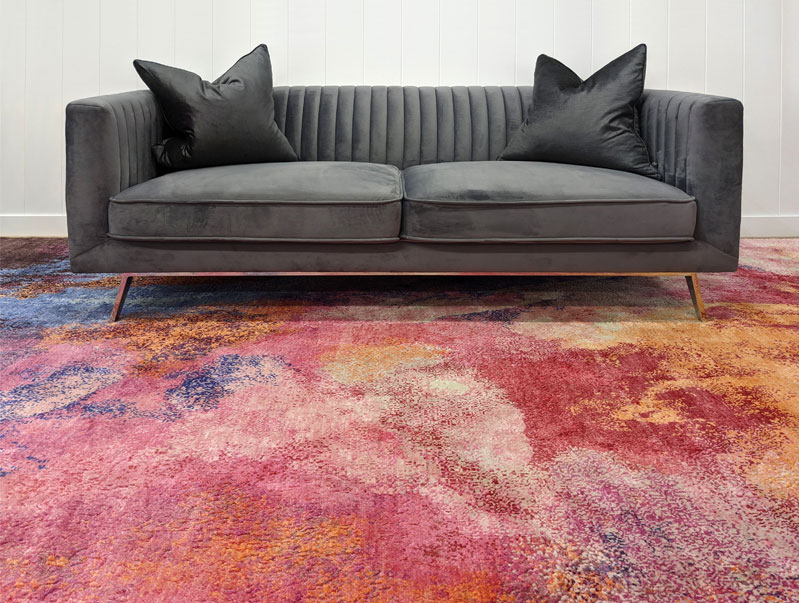 Bold and vivid pink, red and orange luxury rug