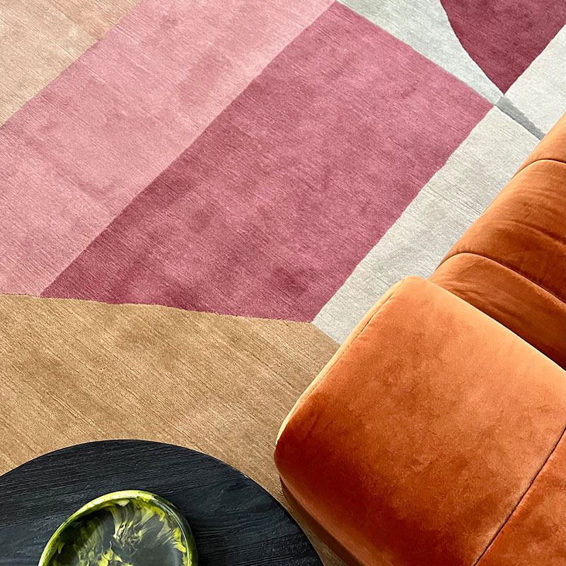 Bold intersecting shapes, strong shades and soft neutrals, wool geometric rug